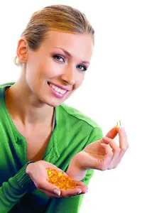 omega 3 capsules on the hands